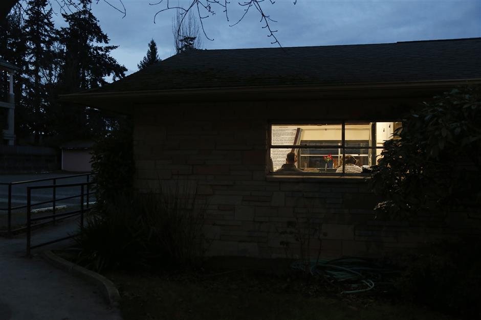 In this Dec. 8, 2018 photo, young men gather to talk after a 12-step meeting for Internet & Tech Addiction Anonymous in Bellevue, Wash. The meeting is run much like other 12-step meetings for addicts, but the focus is video games, devices and internet content that has become a life-harming distraction. The Seattle area has become a hub for treatment of extreme tech use. (AP Photo/Martha Irvine)