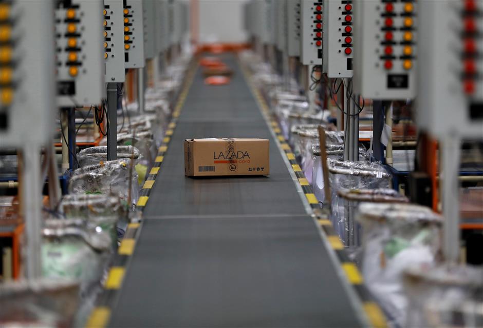 A package for delivery is seen on a conveyor belt at online retailer Lazada's warehouse in Depok, south of Jakarta, Indonesia March 26, 2018. Picture taken March 26, 2018. REUTERS/Darren Whiteside
