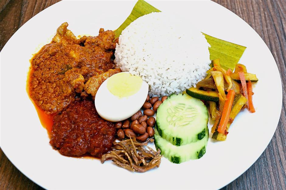 Nasi Lemak with Pork Curry is one of the signature dishes at Tables of Joy.