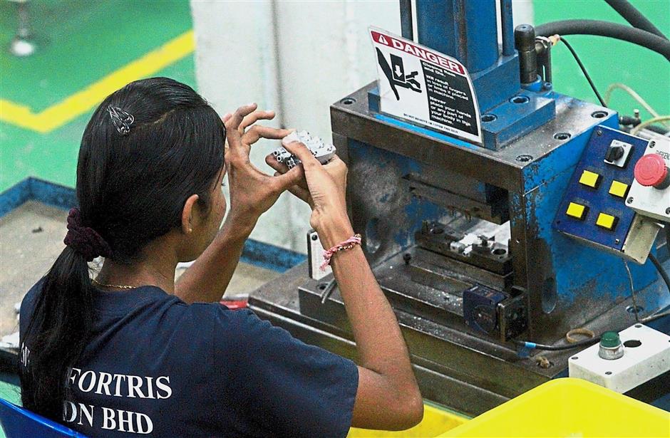 An employee conducting quality check.
