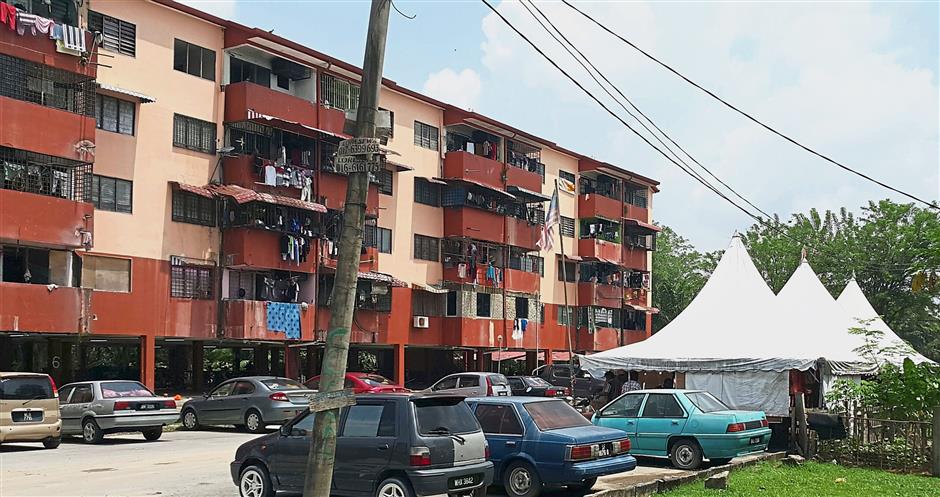Several Taman Permata Block 5 residents were living in tents (on the right) for three years after their flats were declared unsafe by the authorities in June 2013. — ELAN PERUMAL/The Star