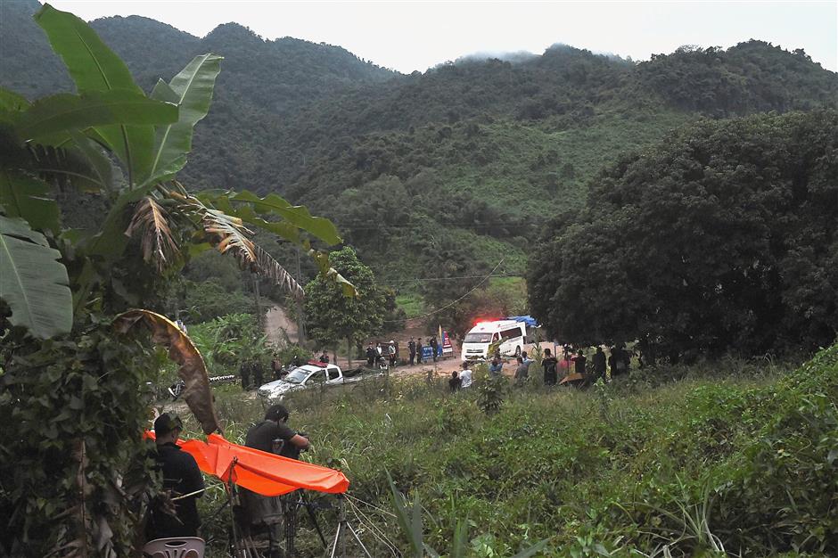 Medical attention: An ambulance carrying one of the rescued boys leaving the Tham Luang cave area. — AFP