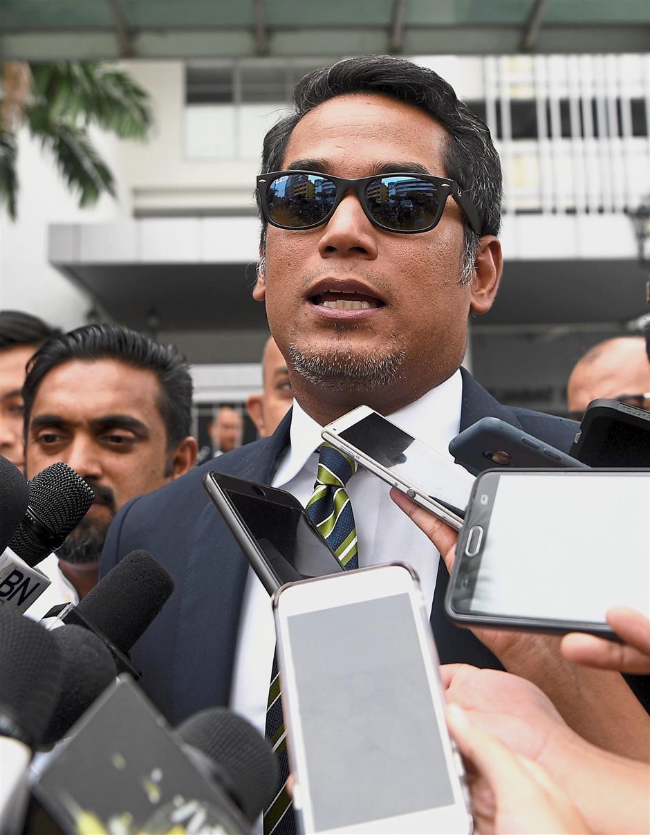 Take action: Rembau Member of Parliament Khairy Jamaluddin speaking to reporters after lodging a police report on the allegations by Lim over the RM18bil ‘robbery’ at Sentul District Police Headquarters. — Bernama