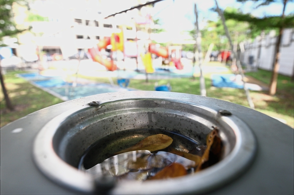 This ash tray on a rubbish bin at a children’s playground within the compound of Damai Apartments is an ideal breeding site for mosquitoes.