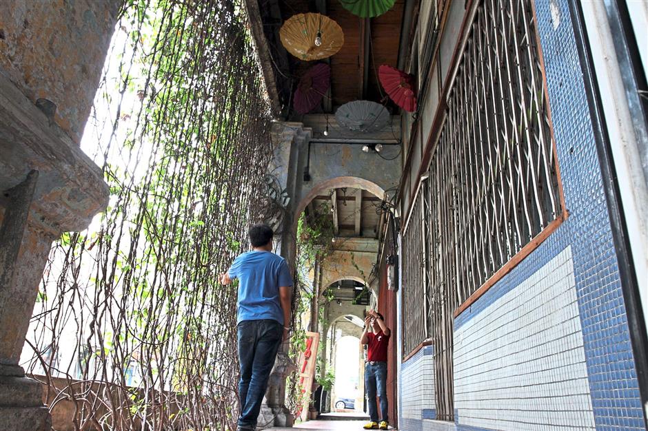 While Ipoh (left) is still being developed, many still find it quiet and prefer the hustle and bustle of bigger cities like Kuala Lumpur (right).
