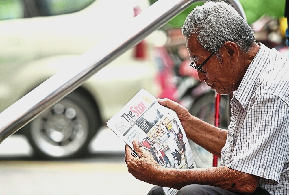 Tan, 84, has been living on the streets of Pudu for five years. He says he sleeps in the alleys with other homeless seniors.