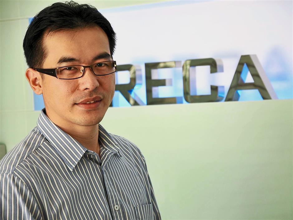 Candid shot and posing of Areca Capital CEO Danny Wong.