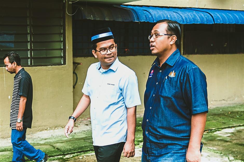 Caring leader: Akmal listening to the concerns of a resident.