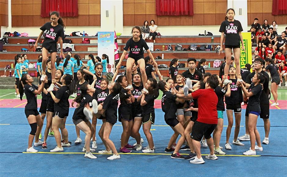 Carlyx, one of the teams that took part in the Cheer 2018 clinic session at Sri Kuala Lumpur, Subang Jaya, working together to perfect their routine. — Photos: NORAFIFI EHSAN/The Star