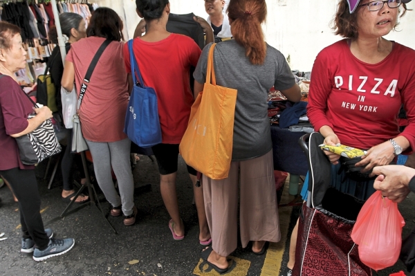 While more consumers are using reusable bags, non-biodegradable plastic bags are still pervasive, especially at wet markets.