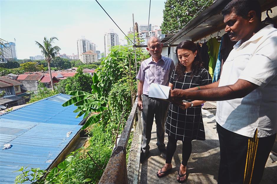 Grassroot focus: Yeoh, here with former Segambut MP Lim Lip Eng, visiting a resident. The deputy minister now reserves Saturdays for going down to Segambut and meeting her constituents.