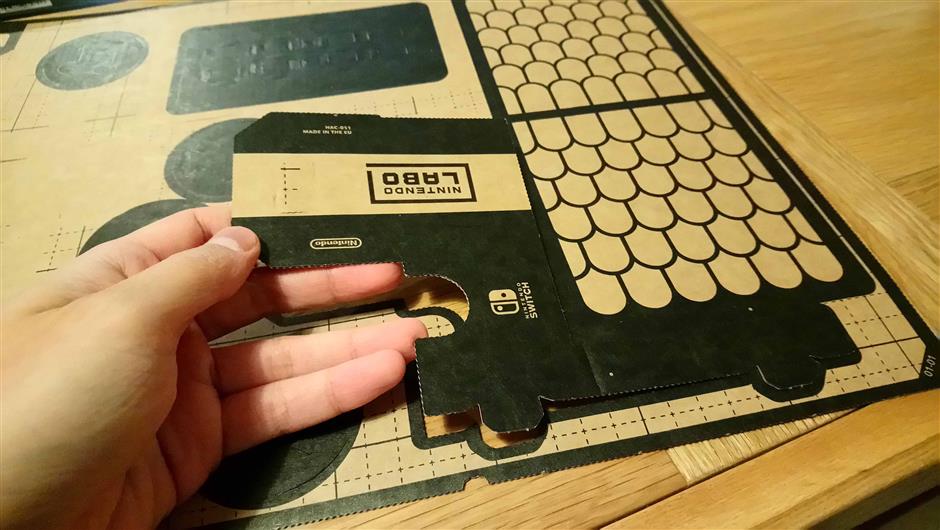 The cardboard pieces pop out very easily. Scissors and glue aren't required, unless you're making repairs for some reason.