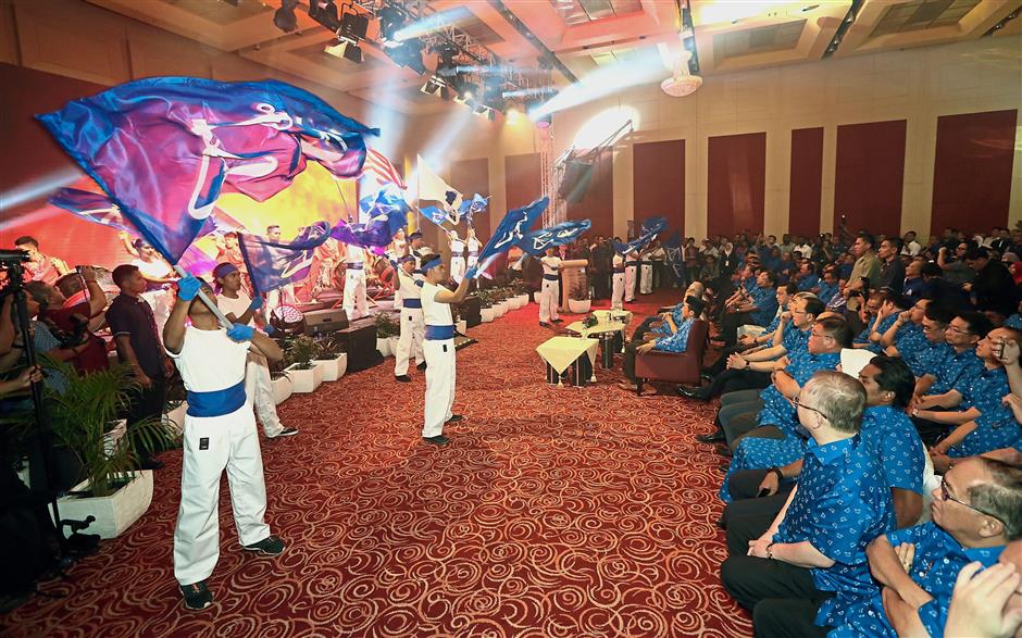 Eye-catching: Performers putting on a colourful show during the launching of ‘theRakyat’ portal.