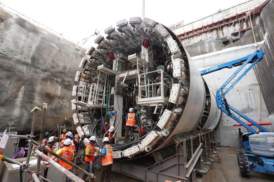 Sophisticated machinery: Locally trained crew putting the TBM parts together for the milestone launch.