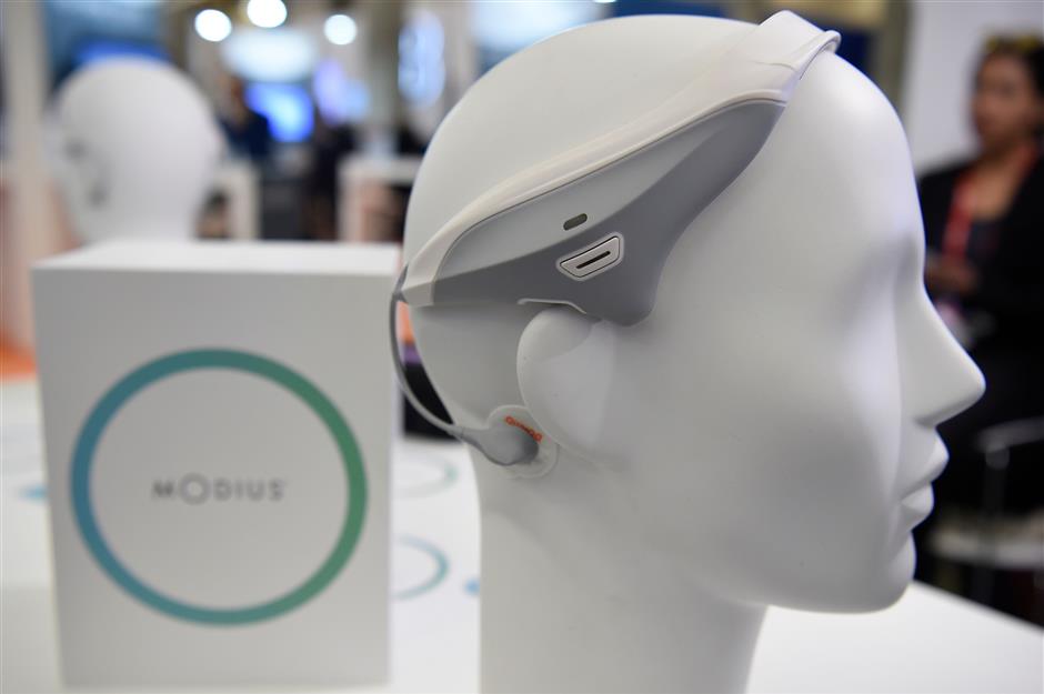 Picture taken of a Modius headset device that stimulates the part of the brain known to control fat storage, metabolism and appetite at the Mobile World Congress (MWC), the world's biggest mobile fair, on February 26, 2018 in Barcelona. the Mobile World Congress is held in Barcelona from February 26 to March 1.  / AFP PHOTO / Josep LAGO