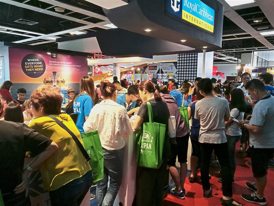 Cruise lovers crowding the Royal Caribbean Cruise booth, where promotions included special deals for its cruise liner ‘Symphony of the Seas‘.