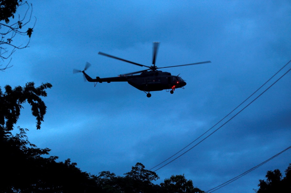 A military helicopter believed to be carrying rescued schoolboys takes off near Tham Luang cave complex in the northern province of Chiang Rai, Thailand, July 8, 2018. - Reuters 