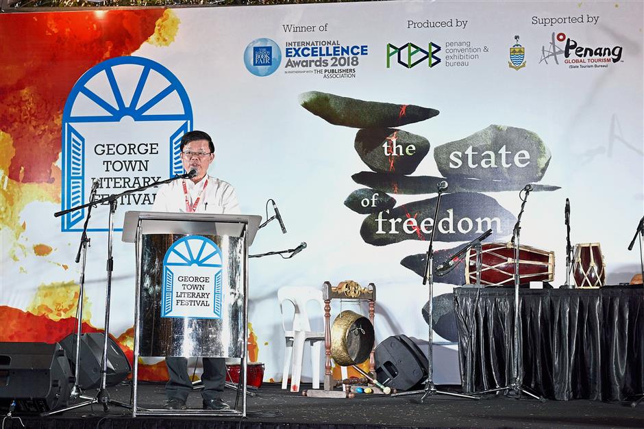 Guests, writers and visitors are all ears at the official opening of the George Town Literary Festival at Seh Tek Tong Cheah Kongsi in Armenian Street, George Town.