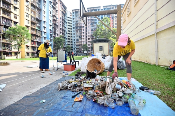 A volunteer from Trash Hero Kuala Lumpur separating the rubbish collected as some can be recycled.