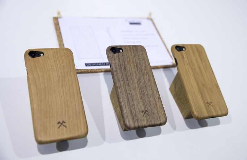 Hard cases, some of which can even be made out of materials like wood, enclose the outer edges of the device and there are cut-out sections for the phone's buttons and camera. Photo: Florian Schuh/dpa