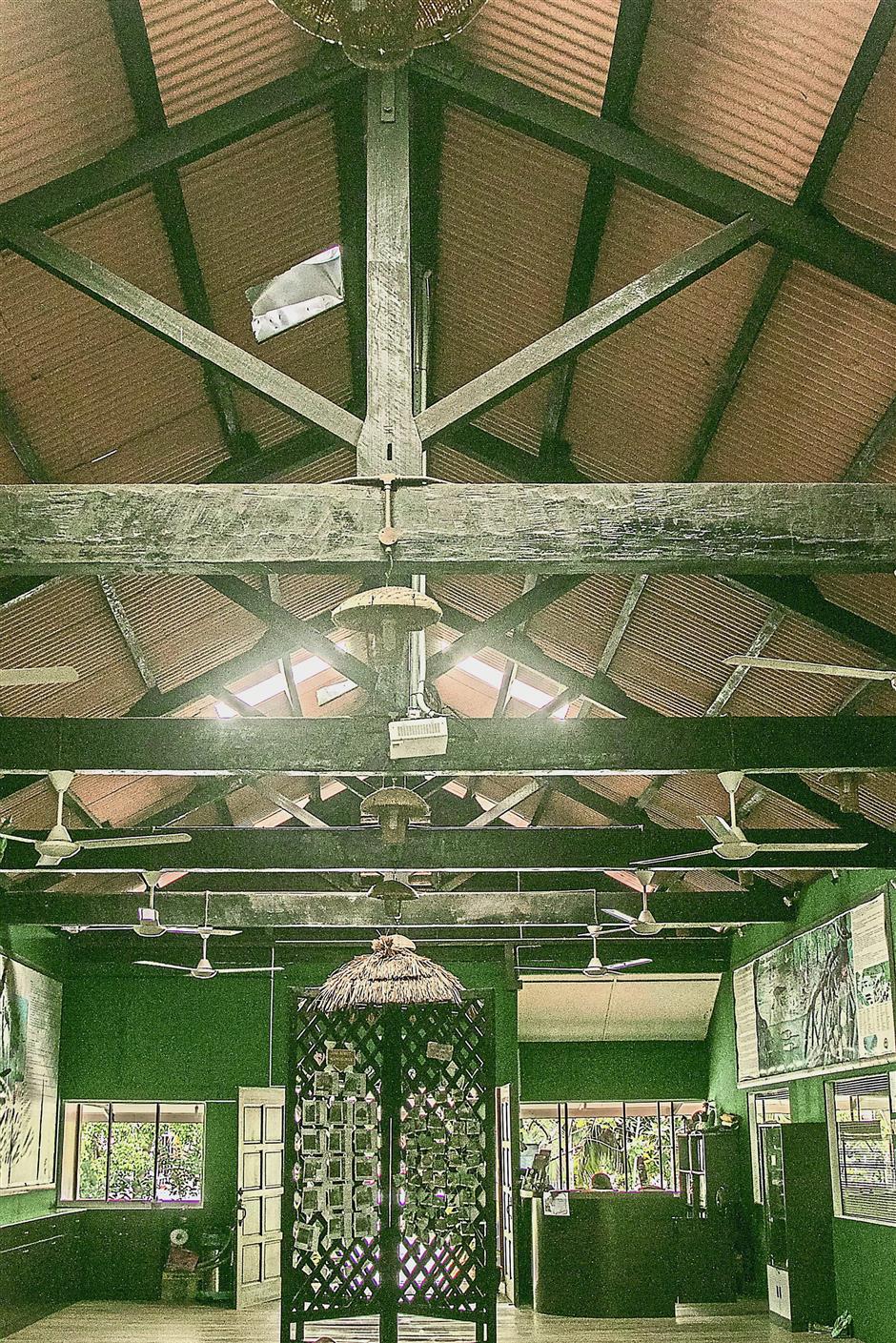 The ceiling beams have visible rough marks possibly indicating they were cut using a push-pull long handsaw commonly used over a century ago.