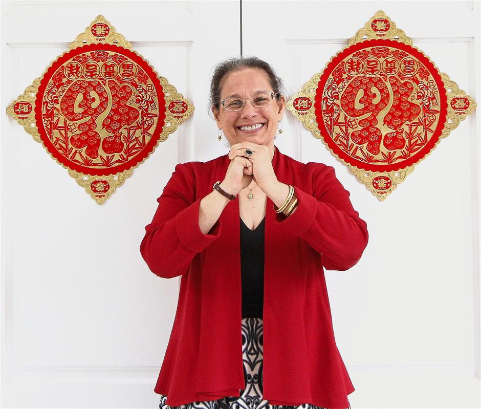 Warm greetings: Lakhdhir wishing Malaysians Gong Xi Fa Cai in front of her residence in Jalan Langgak Golf, Kuala Lumpur.
