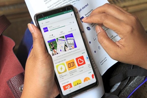 Users can rent Beam’s shared eScooters using its app. It charges an initial fee of RM1.50 followed by 45sen for every minute. ”” Photos: LOW LAY PHON/The Star
