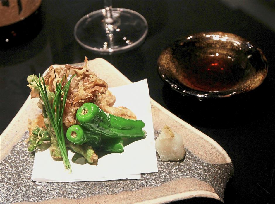 A light and lovely vegetable rendition of Taranome Sprouts & Maitake Tempura served with Saito Junmai.