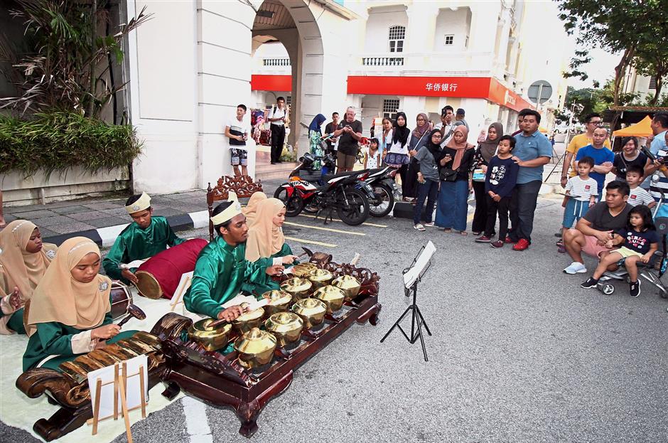 Visitors watching the gamelan performance during the Sama-Sama Ria Cultural Street Fest in Ipoh. — Photos: SAIFUL BAHRI/The Star