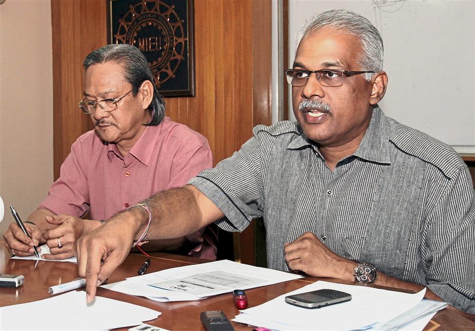 Old hand: File photo from 2012 of Santiago (right) discussing the ‘Water Crisis in Selangor’. With him is then Malaysian Trades Union Congress president Mohd Khalid Atan.