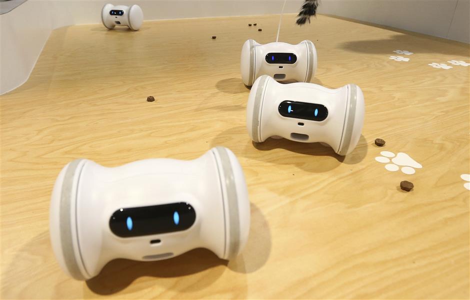 VARRAM has developed a robot to care for your pets while you are away with the VARRAM Pet Fitness Robot, as the company claims this smart device helps with pet anxiety and playtime, offering real-time rewards, like treats, and activities, using the Varram app, you can set a schedule for your pet via Bluetooth, shown at CES International Tuesday, Jan. 8, 2019, in Las Vegas. (AP Photo/Ross D. Franklin)