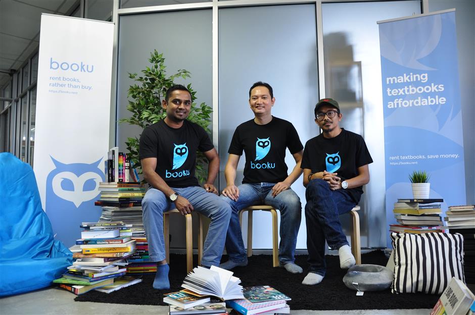 (L-R) Booku's founder and CEO Sivanathan, along with his co-founders, CTO Syed Zulazri and CIO Khairul Azizi.