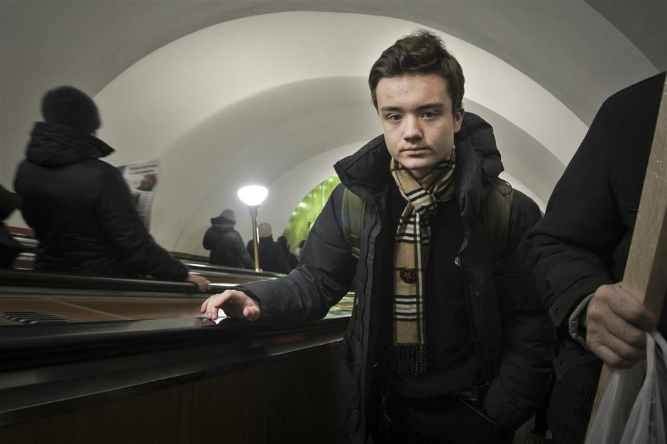 In this photo taken on Thursday, Dec. 20, 2018, High school student Maxim Dautov rides the escalator in the subway on his way to school in St. Petersburg. Two Russian high school students, Leonid Shaidurov and Maxim Dautov, have irked their school by setting up an independent union to voice the students’ concerns. Faced with a backlash, the boys like many other young people in Russia, didn’t take the punishment lying down but went public on social media with their dispute with the principal.  (AP Photo/Nataliya Vasilyeva)