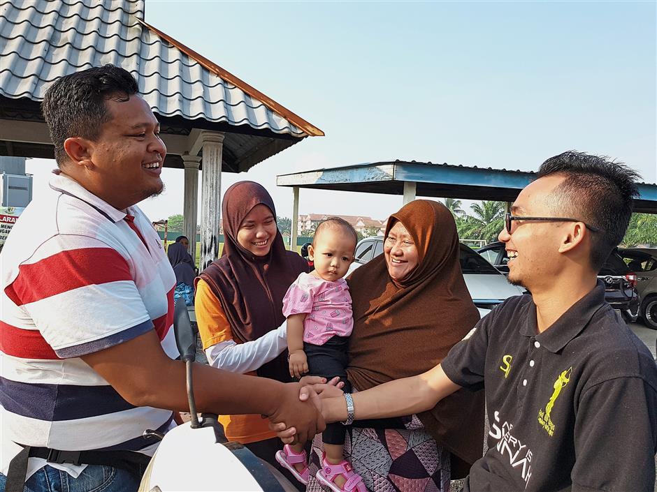 Polling stations became a place for old friends and neighbours to meet as seen here in SK Bandar, in Kuala Langat.