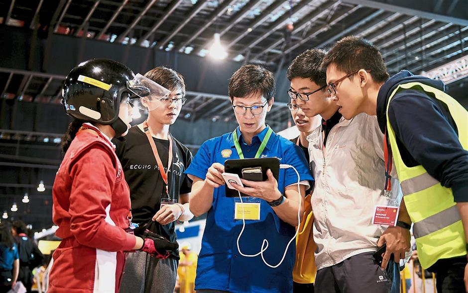 Team HuaQi-EV, 301, from Guangzhou College of South China University of Technology, China, competing under the Prototype – Battery Electric category, eagerly awaiting the technical inspection results.