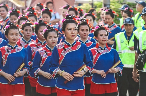 The 52 women in traditional Meizhou costumes sporting the unique sailboat-shaped hairstyle were the highlight of this year’s celebration.