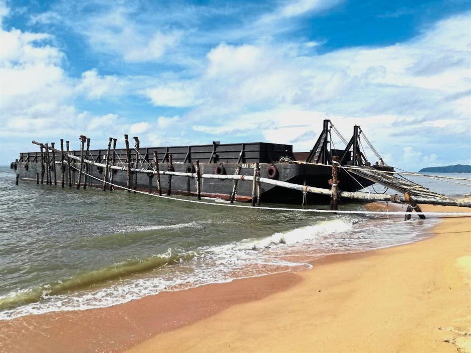 A barge believed to be used for dredging has been in the area for about a week say environmentalist.