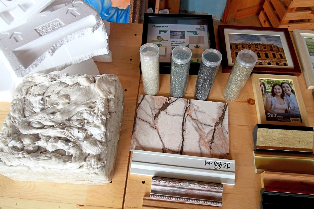 Bulky polystyrene from electronic goods packaging can be recycled into small plastic pallets and turned into picture frames, furniture and even solid walls.