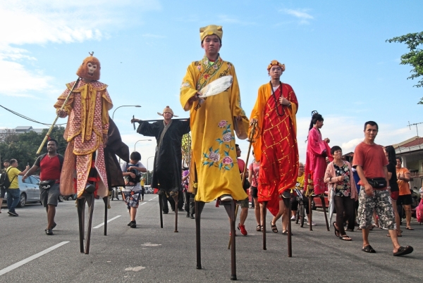 Stilt-walkers dressed up as Chinese mythological characters from the classic ‘Journey to the West’ story.