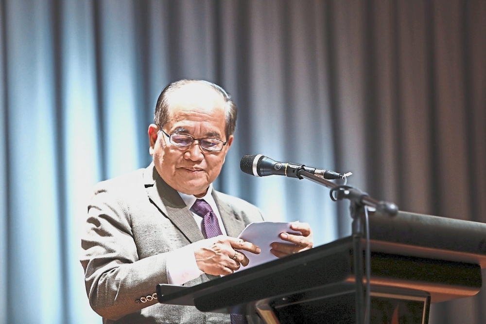 Uggah addressing Modernisation of Agriculture, Native Land and Regional Development Ministry staff at a gathering in Kuching.