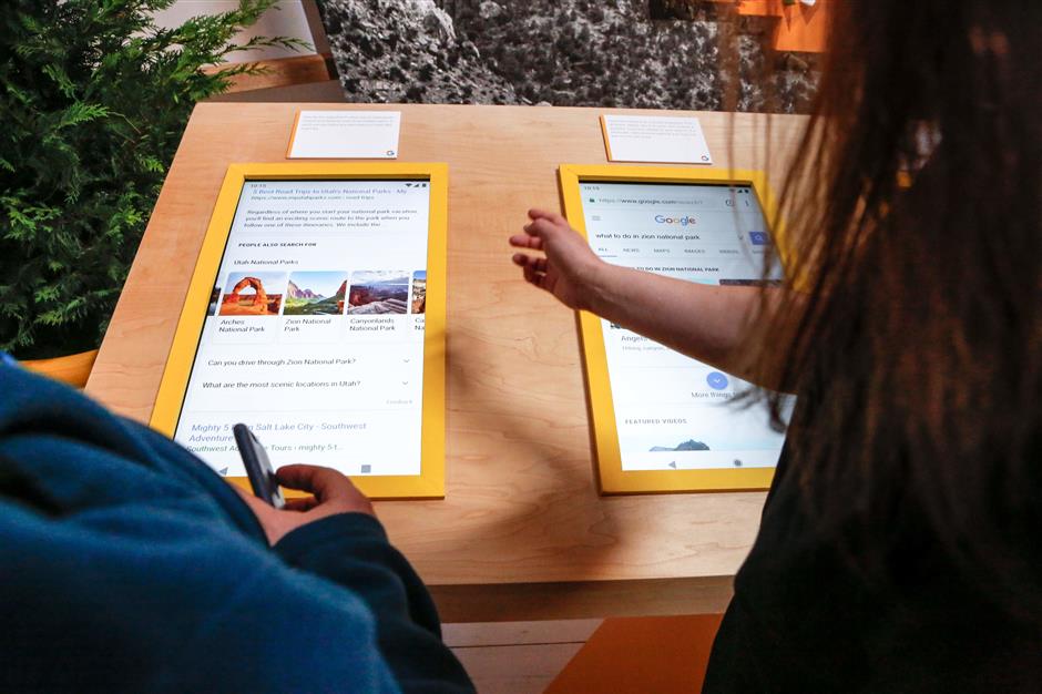 Demostrations of Google's newest Search features including, activity card, smart video, and Google Lens are seen at the Google Search 20th Anniversary Event on September 23, 2018 in San Francisco, California. (Photo by Amy Osborne / AFP)