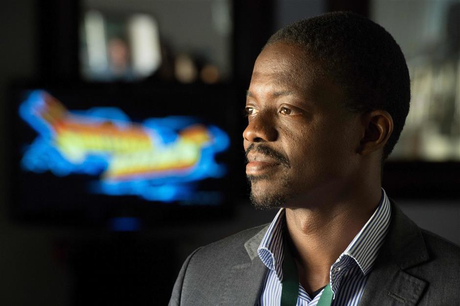 Sidick Bakayoko, founder of Paradise Games, in the Ivory Coast, talks about his work at Africa Games Week, one of Africa's most significant electronic gaming expo's on November 28, 2018, in Cape Town. - This event brought game developers from various African countries, together with some representatives from the international gaming companies, and other people interested in the games industry. Many other African developers are also opting to tailor games for mobile devices instead of traditional consoles like PlayStation or desktop computers, leading to a surge of handheld innovation on the continent. (Photo by Rodger BOSCH / AFP)