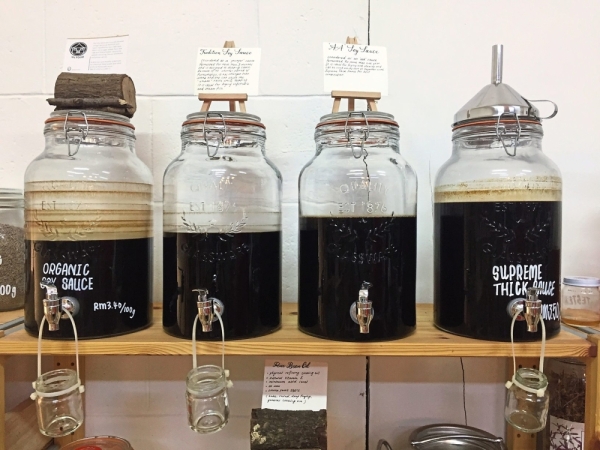 Various types of locally produced soy sauce available for purchase at A Bit Less.