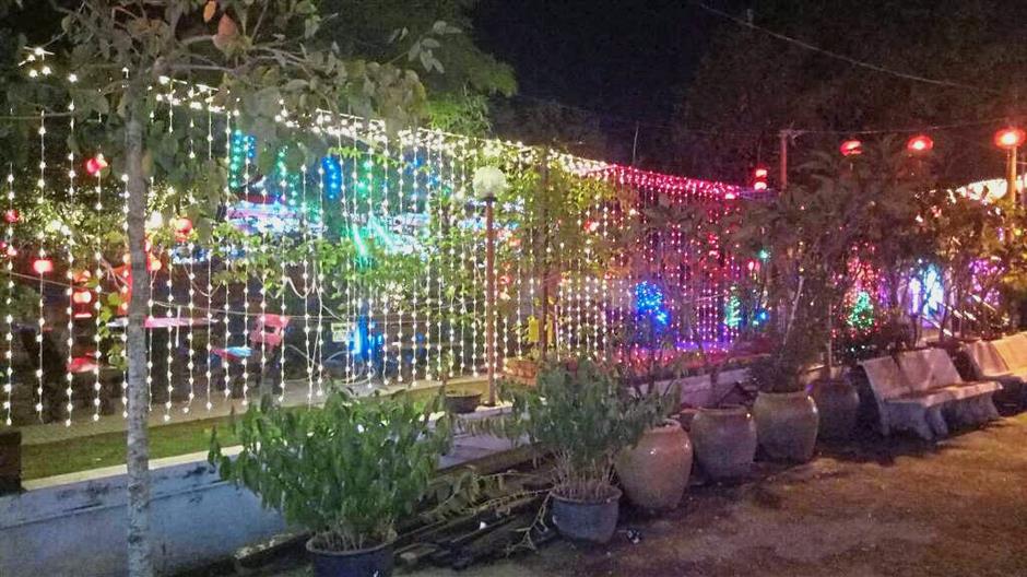 The temple’s grounds were decorated with strings of LED lights for the occasion.