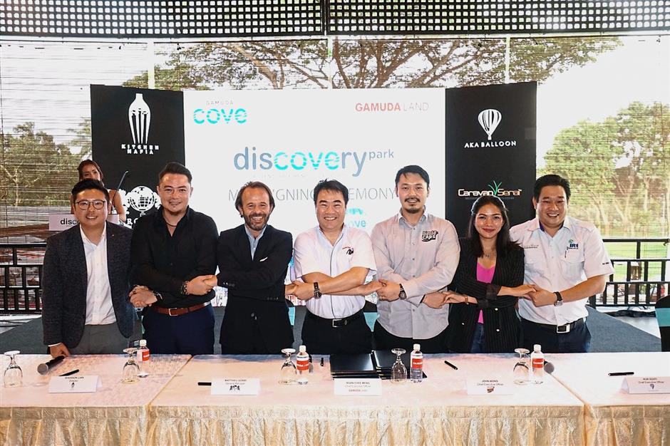 (From left) Invade CEO Kent Teo, Kitchen Mafia director Sherson Lian, Aerophile Group general manager Matthieu Gobbi, Gamuda Land CEO Ngan Chee Meng, Blastacars Malaysia CEO John Wong, AKA Balloon CEO Nur Izzati Khairudin and Caravan Serai managing director Chua Teck Huang after signing the MoU.