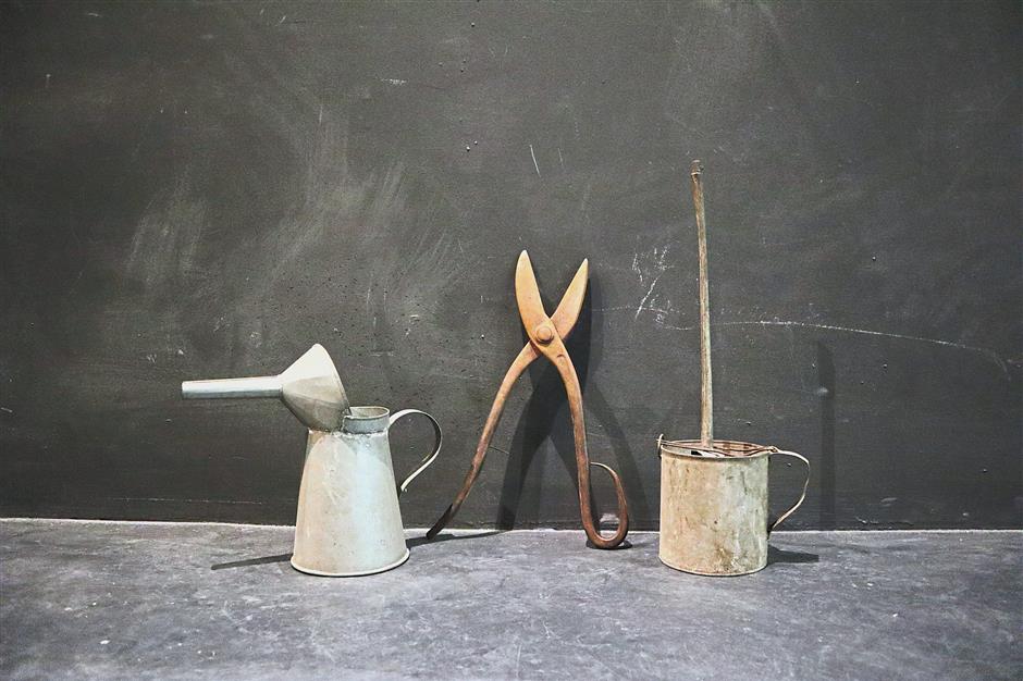 The carbide lamp (right) traditionally used by rubber tappers was the main item produced by Sin Wah Cheong in addition to other household items like tin cans (left) and shears. — Photos courtesy of HING RU CHENG