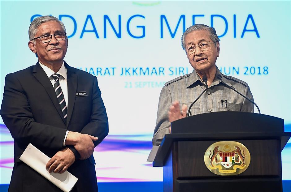 Cleaning house: Dr Mahathir speaking to reporters after Cabinet committee meeting on corruption as Director-General of Governance, Integrity and Anti-Corruption Centre Tan Sri Abu Kassim Mohamed looks on. — Bernama