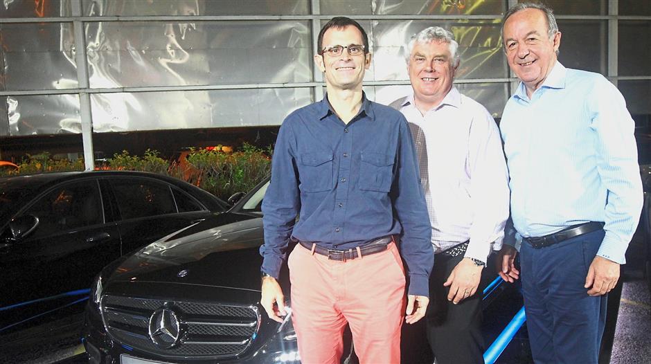 (From left) Dokhelar, Oakes and Regnault with the grand prize of the Martell Be Curious Dinner series’ Spend and Win contest – a Mercedes-Benz E200 Avantgarde (CBU).