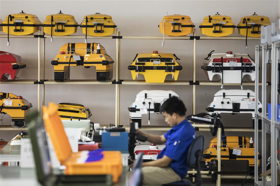 Unmanned surface vessels sit on a rack at an Oceanalpha Co. facility in Zhuhai, China, on Thursday, May 18, 2018. Oceanalpha, one of a handful of companies around the globe specializing in ocean-going drones that operate on the surface, has fired the interest of some of China's biggest venture capitalists. Photographer: Qilai Shen/Bloomberg
