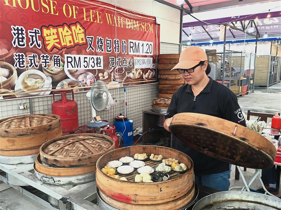 Low says she is worried about her daily sales as she is unable to keep the dim sum she makes for long if it is not sold at the Ipoh Walk Night Bazaar.